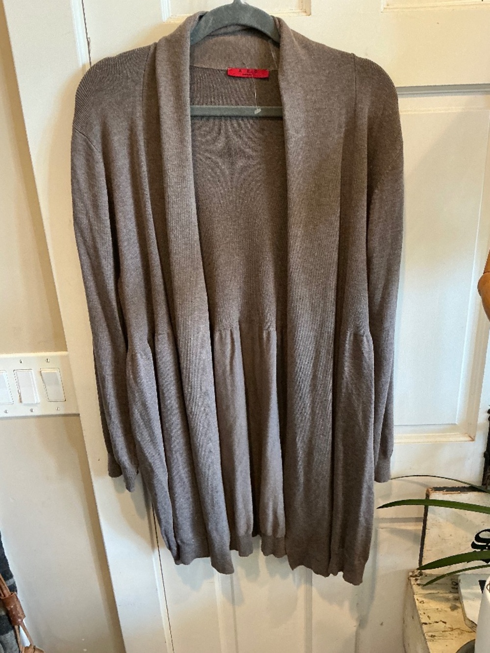 RED knit sweater with flouncy lower area. Brand new with tags. Plus size 3x